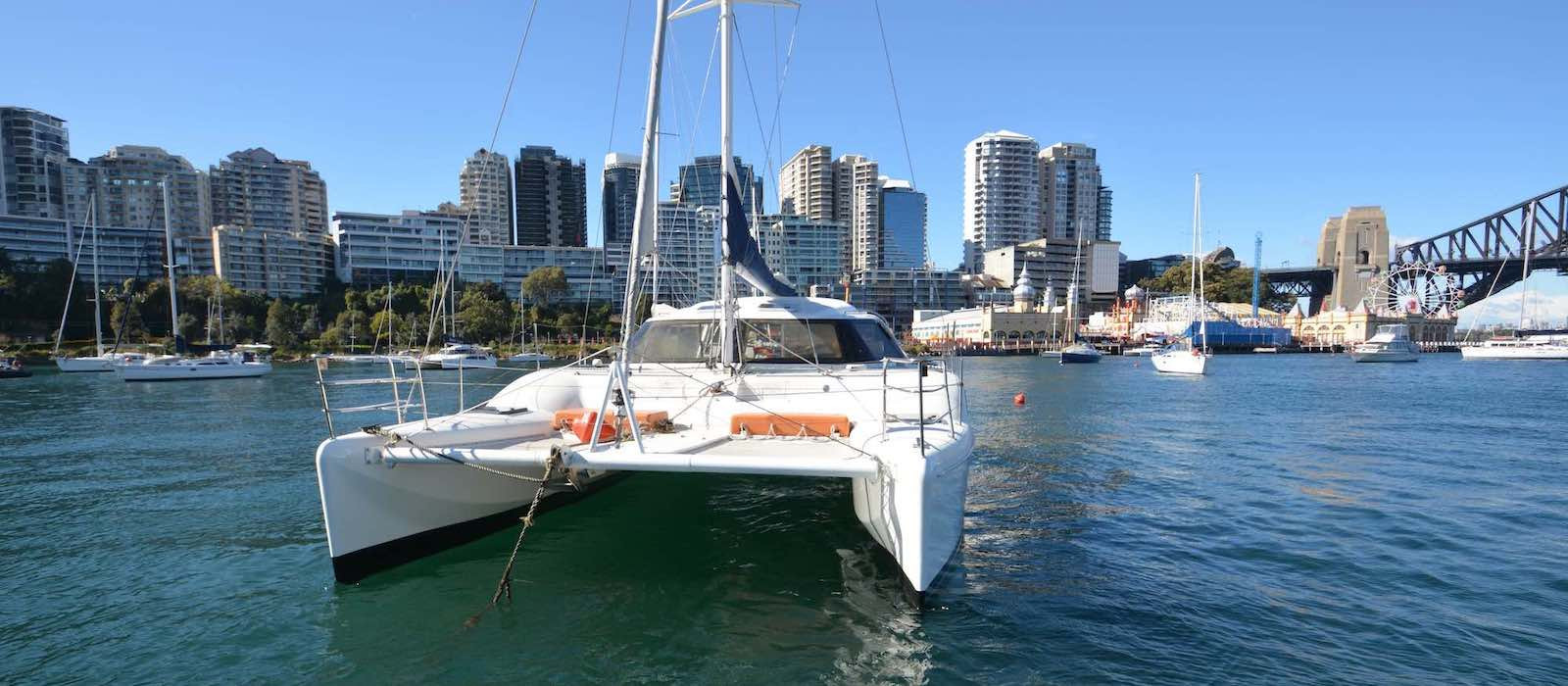 Harbour Bridge background with Skippered yacht charter on Seawind 1000