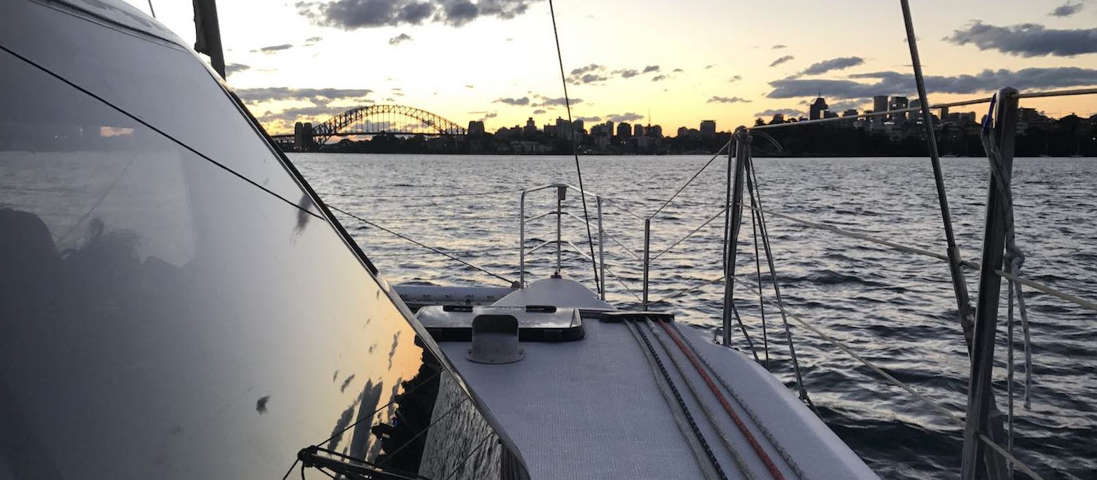 Skippered yacht charter on Seawind 1000 as the sun sets 